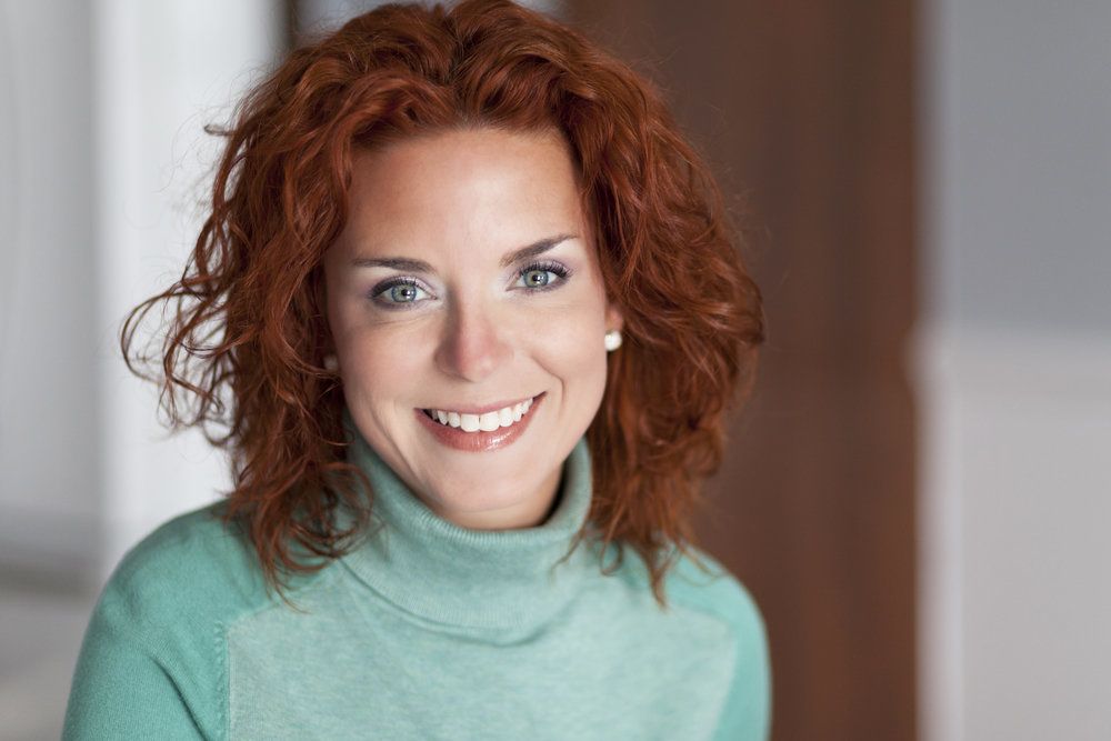 A man undergoes full-mouth reconstruction and shows off the results.